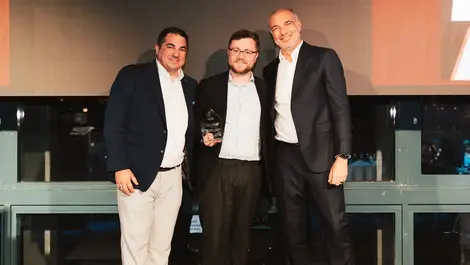 Alex avery notitia manager accepting award on behalf of snaicc from qlik